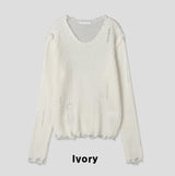 Reverse damage V-neck knitwear