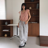Cuyan dot button strap short-sleeve blouse