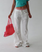 linen white low bootcut jeans