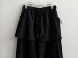 Log banding layered pocket skirt pants