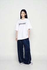 25SS ONE POINT LOGO COLORING WIDE TRACK PANTS NAVY