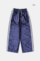 Bright glossy track pants