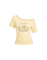 ダイアサマーヴィンテージグラフィックシャーリングワンショルダーTシャツ バター