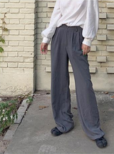 Black loose straight-leg suit pants with a drape effect