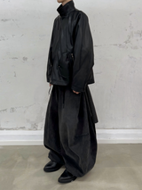 RELABEL Spatial Relations (Vietnam) Deconstructed, segmented, concealed multi-layering Multi-pocket silhouette leather jacket