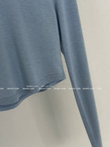 It's soft. A long-sleeved cropped shirt