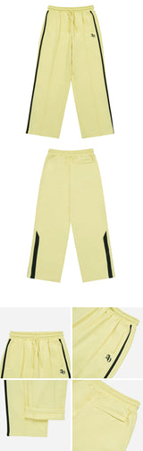 [24SS] SYMBOL LOGO TRACK JERSEY PANTS LIGHT YELLOW