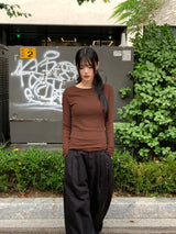 Tatin back buckle strap slit long sleeve t-shirt