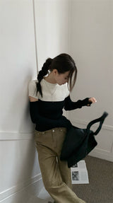 Black and white cut knit top