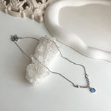 bi サージカルスチールブルーキャットアイコインハートキッチュネックレス / bi Surgical Steel Blue Cats Eye Coin Heart Kitch Necklace