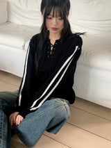 Gender eyelet strap long sleeve knit