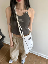 モメオンレタリング刺繍サスペンダークロップドノースリーブ / Momeon lettering embroidered suspenders cropped sleeveless