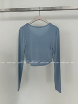 It's soft. A long-sleeved cropped shirt