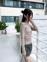 Heat unbuttoned off-shoulder snap totto button long-sleeved t-shirt