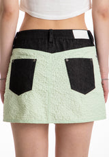 アシメトリックボタンミニスカート / ASYMMETRIC BUTTON MINI SKIRT (MIXED FABRIC)