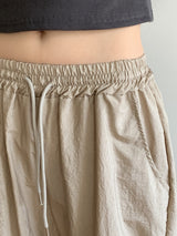 ピディナイロンスリット2ウェイロングワイドジョガーパンツ / Pidi Nylon Slit Two-Way Long Wide Jogger Pants