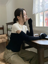 Black and white cut knit top