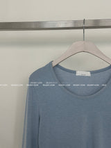 It's soft. A long-sleeved cropped shirt