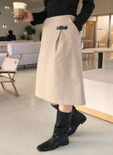 Ancient buckle midi skirt