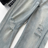 Belted light blue bootcut denim pants