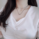 layered string necklace