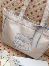 me abrace Canvas embroidered shoulder bag