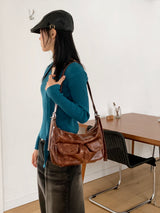 Unbarred two-pocket vintage washed leather shoulder bag