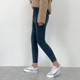 Whiskered Two-Button High Waist Skinny Jeans