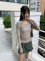 Heat unbuttoned off-shoulder snap totto button long-sleeved t-shirt