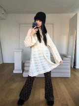 [MADE] Flute Ribbon Strap Punching Wave Knit Dress