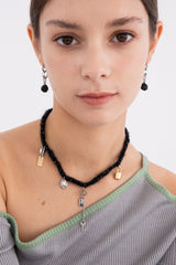 ウールニットユニークオブジェクトネックレス/Wool black knit with unique objects necklace