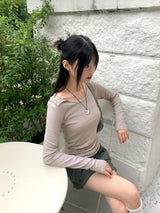Heat unbuttoned off-shoulder snap totto button long-sleeved t-shirt