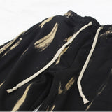 bleach side tuck string sweat pants