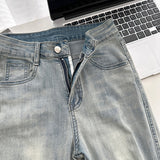 Belted light blue bootcut denim pants