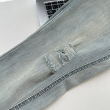 Belted light blue bootcut denim pants