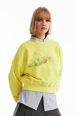 チェリープラネットグラフィッククロップスウェットシャツ / CHERRY PLANET GRAPHIC CROP SWEATSHIRT [YELLOW]