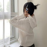 サッドツイストボタンセミジップアップフーディー長袖ニット