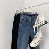Whiskered Two-Button High Waist Skinny Jeans
