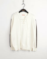 Gender eyelet strap long sleeve knit