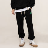 [UNISEX] Zipper Regular Green Flower White Clip Jogger Pants_Black (6676050935926)