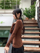 Tatin back buckle strap slit long sleeve t-shirt